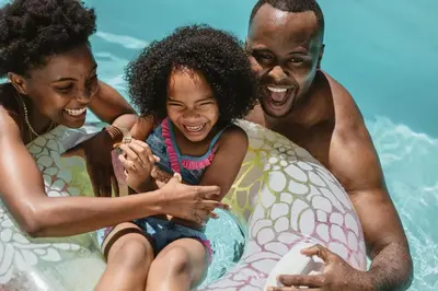 a man and a woman and a little girl on an inflatable at Hyatt House San Diego Sorrento Mesa in Sorrento