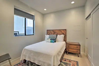 a bedroom with a bed and a window at Chic San Diego Abode Rooftop Balcony and Bay Views! in San Diego