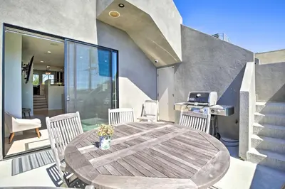 a patio with a wooden table and chairs and a grill at Chic San Diego Abode Rooftop Balcony and Bay Views! in San Diego