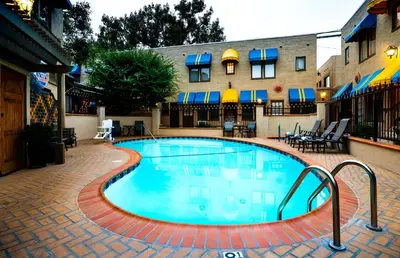 a swimming pool in the middle of a courtyard at El Cordova in San Diego