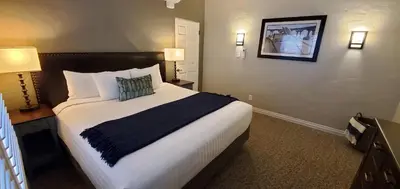 a bedroom with a large bed in a hotel room at El Cordova in San Diego