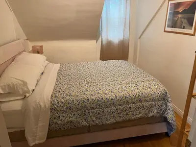 a small bedroom with a bed in a room at Secluded, Charming and Unique! Spacious Apartment EXCELLENT Central Location in San Diego