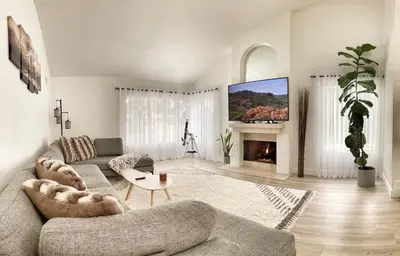 a living room with a couch and a fireplace at OCLuxeBnB Private Resort Living Minutes from Beach in Laguna Hills
