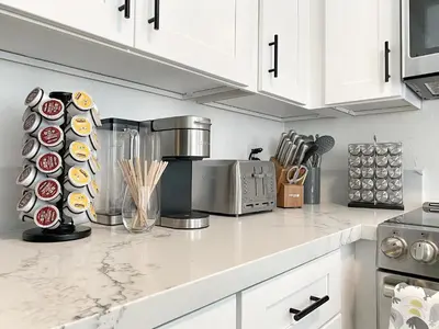 a kitchen with white cabinets and a counter top at OCLuxeBnB Private Resort Living Minutes from Beach in Laguna Hills