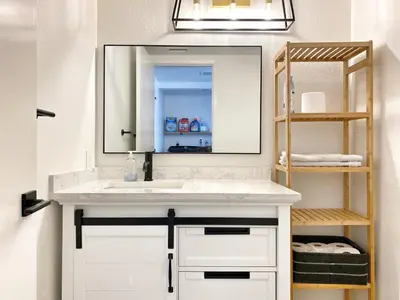a bathroom with a white sink and a mirror at OCLuxeBnB Private Resort Living Minutes from Beach in Laguna Hills