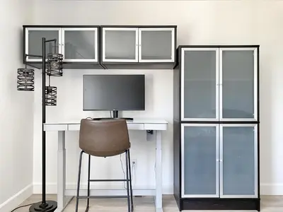 a room with a desk with a monitor and a chair at OCLuxeBnB Private Resort Living Minutes from Beach in Laguna Hills