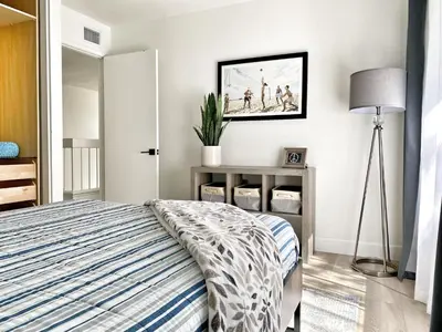a bedroom with a bed and a picture on the wall at OCLuxeBnB Private Resort Living Minutes from Beach in Laguna Hills