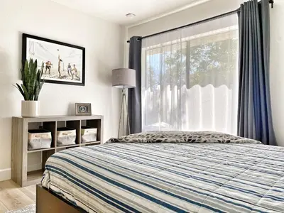 a bedroom with a bed and a window at OCLuxeBnB Private Resort Living Minutes from Beach in Laguna Hills