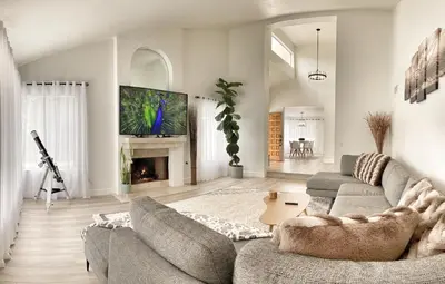 a living room with a couch and a fireplace at OCLuxeBnB Private Resort Living Minutes from Beach in Laguna Hills