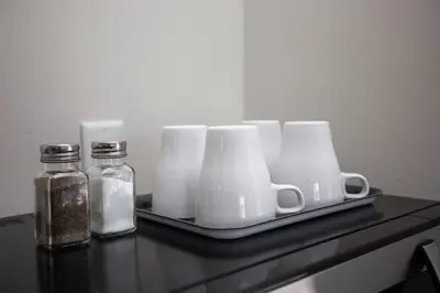 a tray with cups and mason jars on a table at Cozy Studio next to San Diego DT and Balboa Park in San Diego