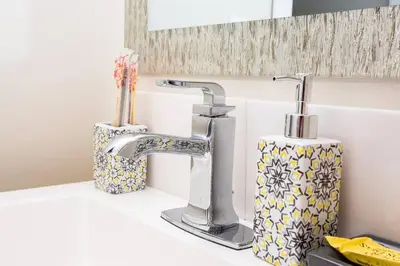 a bathroom counter with a sink and a faucet at Awesome Balboa Park View with Huge Balcony in SD in San Diego