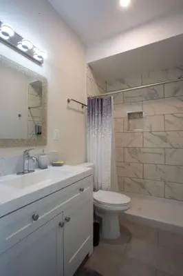 a bathroom with a sink and a toilet and a shower at Luxurious Design One Bedroom Apt near Balboa Park in San Diego