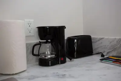 a coffee maker sitting on a counter next to a toaster at Luxurious Studio in Heart of San Diego w Cali King in San Diego