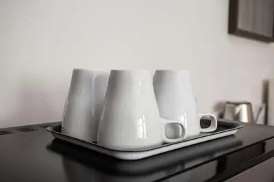 a tray with four white appliances on a counter at Luxurious Studio in Heart of San Diego w Cali King in San Diego