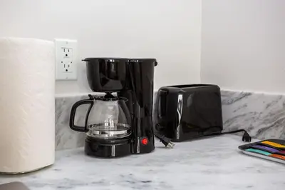 a coffee maker sitting on a counter next to a toaster at Luxurious Studio in Heart of San Diego w Cali King in San Diego