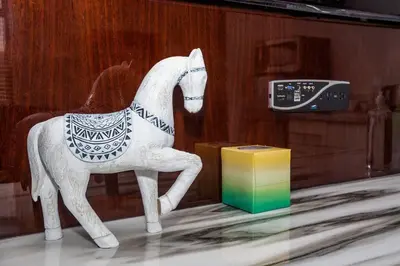 a plastic horse on a table next to a remote control at One Bedroom Apartment with San Diego Downtown View in San Diego