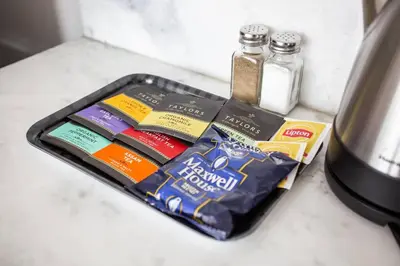 a tray with toothpaste and toothbrushes and a bottle of tooth paste at Spacious 1 Bedroom Apartment in Balboa Park in San Diego