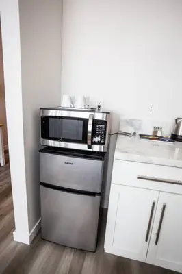 a kitchen with a microwave on top of a stove at Spacious 1 Bedroom Apartment in Balboa Park in San Diego