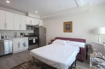 a small kitchen with a bed in a room at Spacious 1 Bedroom Apartment in Heart of San Diego in San Diego