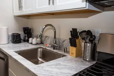 a kitchen with a sink and a counter top at Spacious 1 Bedroom Apartment in Heart of San Diego in San Diego