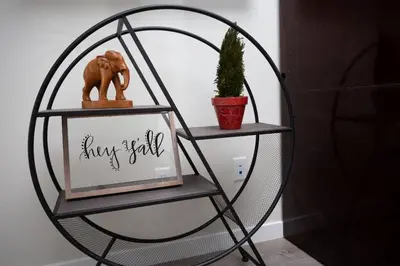 a round shelf with a mirror and a picture at Spacious Studio with Incredible Balboa Park View in San Diego