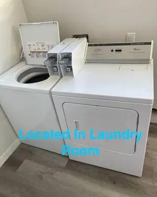a white washer and dryer in a laundry room at Spacious Studio with Incredible Balboa Park View in San Diego