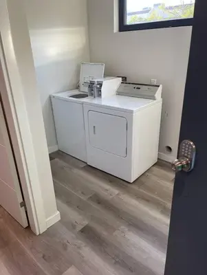 a washer and dryer in a room at Steps to Balboa Park- Brand New Apt - Cozy Studio in San Diego