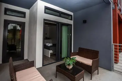 a patio with two chairs and a table and a room at Studio with Large Balcony- San Diego Gateway in San Diego