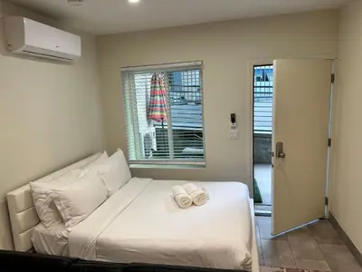 a bedroom with a bed with two towels on it at Studio with Private Entrance next to Balboa Park in San Diego