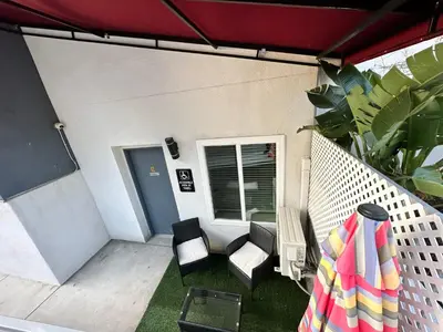 a patio with a table and chairs and an umbrella at Studio with Private Entrance next to Balboa Park in San Diego