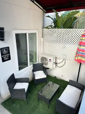 a patio with chairs and a table and a heater at Studio with Private Entrance next to Balboa Park in San Diego
