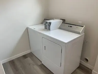 a washing machine sitting on top of a white washer at Premier Location with Great Scenic Downtown View in San Diego