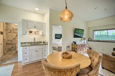 a kitchen and living room with a table and a bed at Rancho Santa Fe Casita - Gate Guarded Community! in Rancho Santa Fe