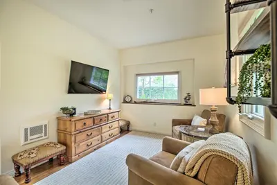 a living room with a couch and a tv at Rancho Santa Fe Casita - Gate Guarded Community! in Rancho Santa Fe