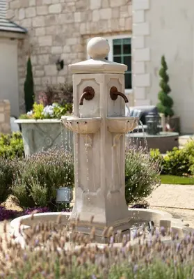 a water fountain in the middle of a garden at Domaine Chardonnay in Temecula