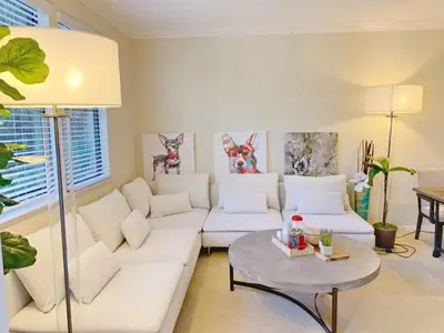 a living room with a white couch and a table at Irvine 2Bedroom 2 Bathroom Apartment with Kitchen Pool gym in Irvine