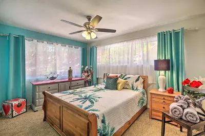 a bedroom with a bed and a ceiling fan at Colorful El Cajon Gem Deck, Garden and Valley Views in El Cajon
