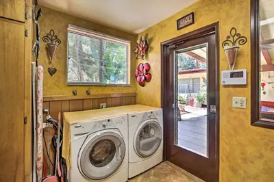 a laundry room with a washer and dryer at Colorful El Cajon Gem Deck, Garden and Valley Views in El Cajon