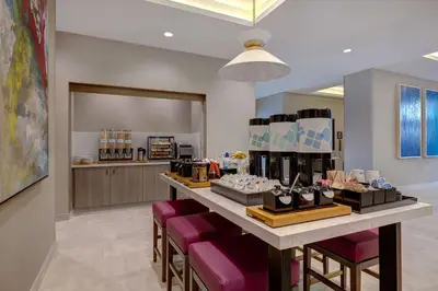 a store with a counter with some shoes on display at Hilton Garden Inn Temecula in Temecula