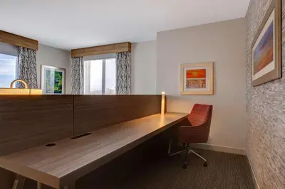 an office with a large wooden desk and a chair at Hilton Garden Inn Temecula in Temecula
