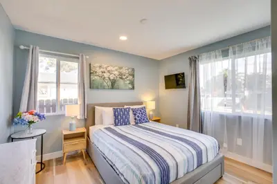 a bedroom with a bed and a window at Modern Duplex Near Gaylord Resort and Bayfront! in Chula Vista