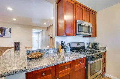 a kitchen with a stove and a microwave at 1 Mi to Gaylord Resort and Bayfront Updated Duplex in Chula Vista