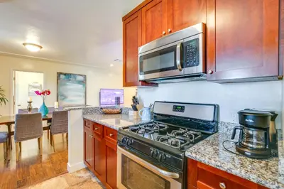 a kitchen with a stove and a microwave at 1 Mi to Gaylord Resort and Bayfront Updated Duplex in Chula Vista