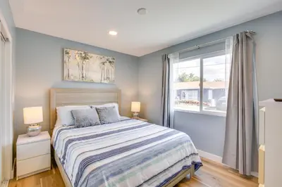 a bedroom with a bed and a window at 1 Mi to Gaylord Resort and Bayfront Updated Duplex in Chula Vista