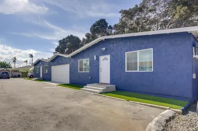 a blue house with a car parked in front of it at 1 Mi to Gaylord Resort and Bayfront Updated Duplex in Chula Vista