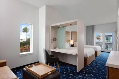 a hotel room with a bed and a desk at SpringHill Suites by Marriott Oceanside Beach in Oceanside