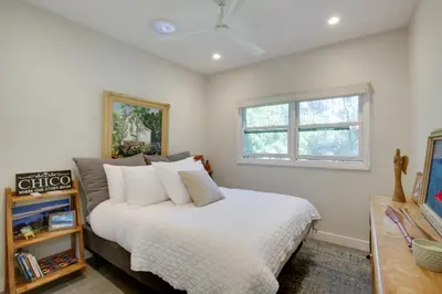a bedroom with a white bed and a window at Serene San Diego Retreat with Deck - Walk to Bay! in San Diego