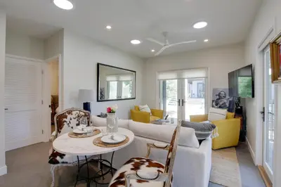 a living room with a table and a couch at Serene San Diego Retreat with Deck - Walk to Bay! in San Diego