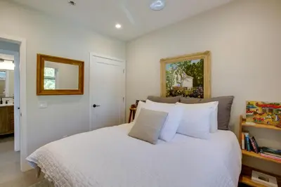 a bedroom with a white bed with white pillows at Serene San Diego Retreat with Deck - Walk to Bay! in San Diego