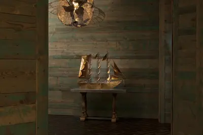 a statue of a ship on a table in a room at Kona Kai Resort & Spa, a Noble House Resort in San Diego